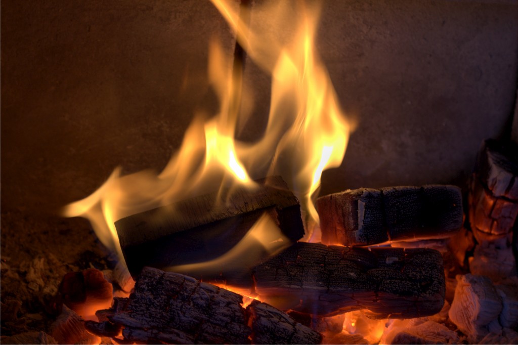 This fire burns in an old gas fireplace converted in a wood fireplace.