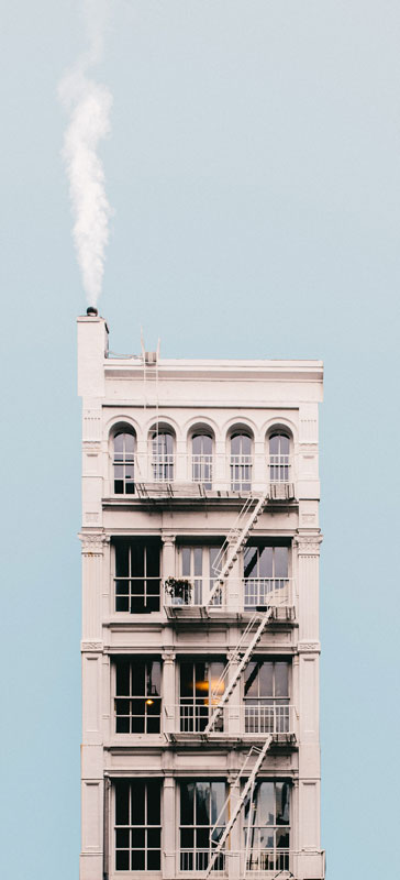 Image from Jeffrey Czum, pexel -- Nice apartment building with chimney, should I hire to clean my chimney?