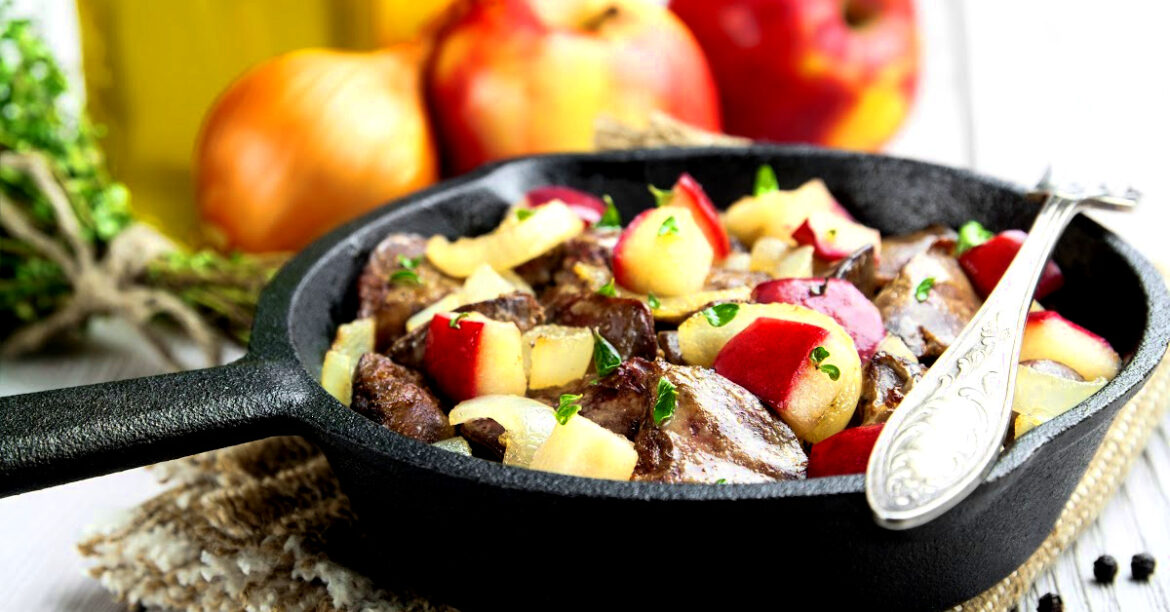 Cooking on Woodstove with cast iron pork, apple and onions