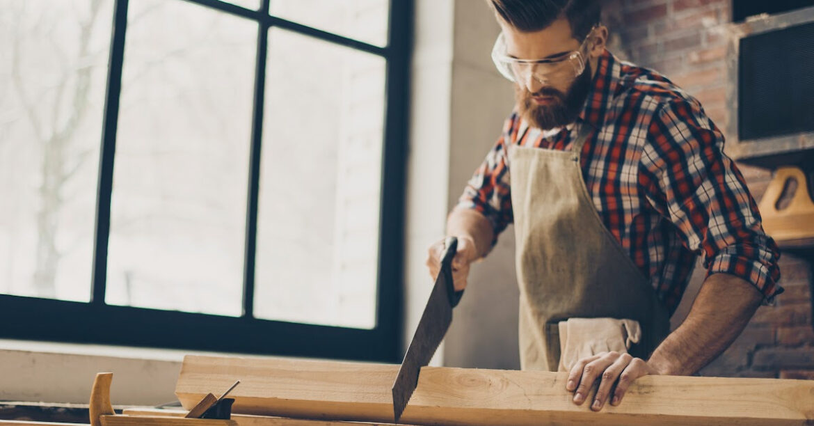 How to Build a Fireplace Mantel Yourself_ a man is building a mantel