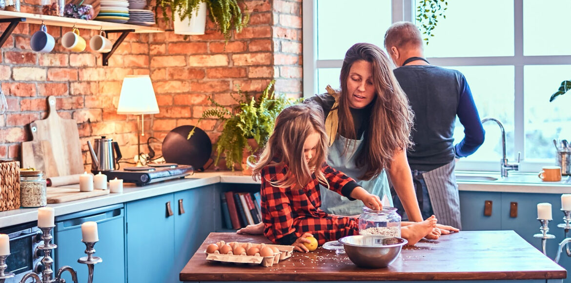 Kitchen Ambiance to Create a Haven for You and Your Guests - a family is cooking in their kitchen