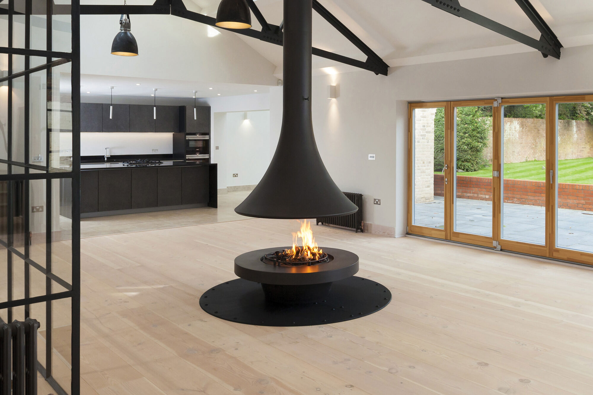 Napoleon freestanding fireplace in a bright modern living room – spring home readiness tips